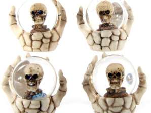 Skull snow globe in skeleton hand per piece