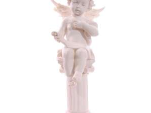 Little angel sitting on pillar