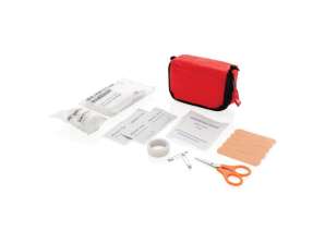 Compact first aid kit in a red bag – safe on the road