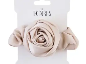 Cremefarbenes rosa Haarband auf einem Abzeichen GUM163K