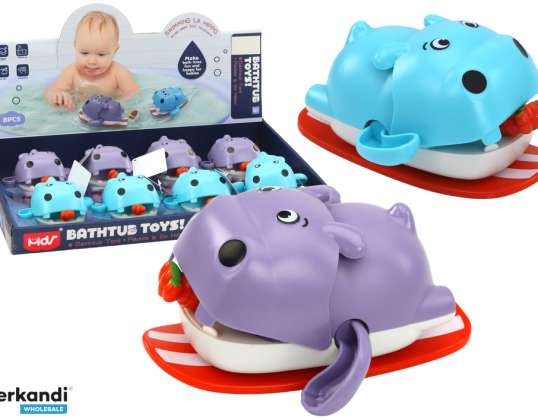 Wind-up galleggiante ippopotamo giocattolo da bagno su una tavola
