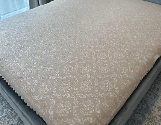Jacquard doilies with embossing. Bedspread for a sofa. Bedspread.