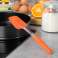 Оранжевая силиконовая лопатка Kinghoff для выпечки и приготовления пищи — устойчива к температуре от -40°C до 260°C, можно мыть в посудомоечной машине — оптом, 26,5x6x1,8 см изображение 1