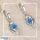 D’élégantes boucles d’oreilles Nezzy rehaussent vos offres avec un attrait irrésistible Variation blanche photo 1