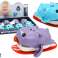 Wind-up galleggiante ippopotamo giocattolo da bagno su una tavola foto 1